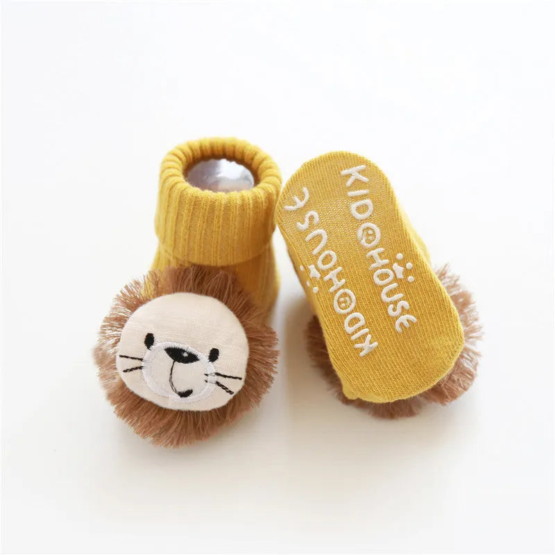 Cotton baby floor socks in assorted colours and patterns including bows, stars, and animal designs.