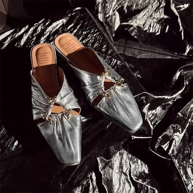 Women's genuine leather slipper with a square toe in a gold colour, showing the low heel and slip-on design.