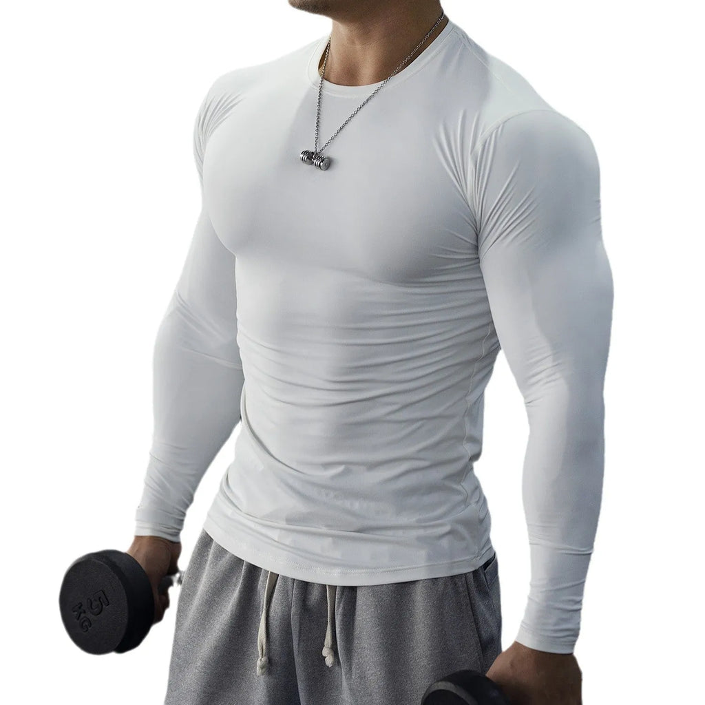 Man wearing black long sleeve slim fit sport tights for running or fitness