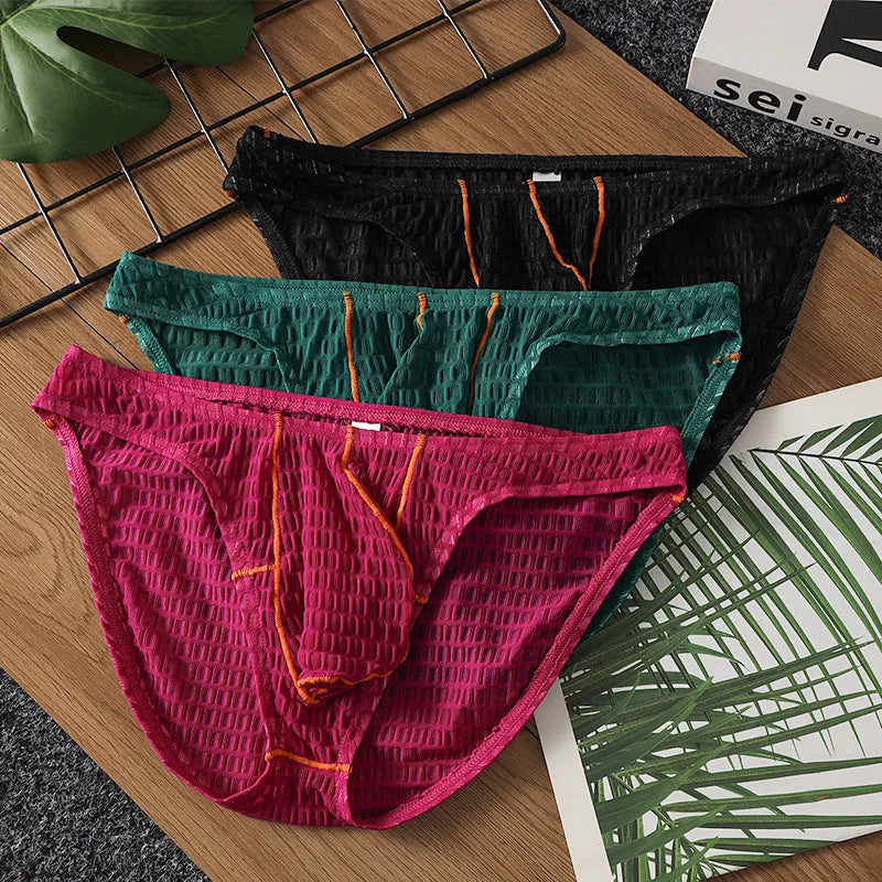 Men's solid colour ice silk lace low waist briefs for sports in white, black, green, rose red, and light purple.