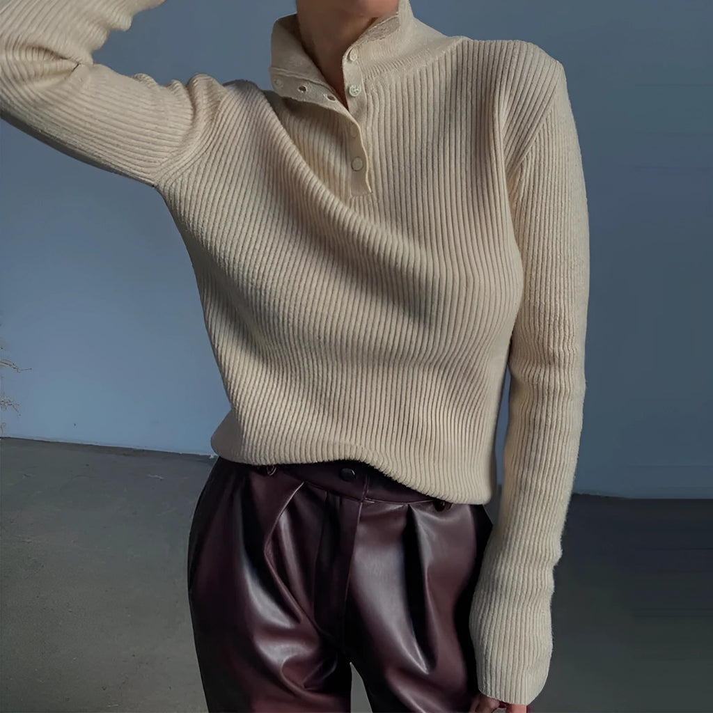 Slim fit silver grey half turtleneck sweater with a breasted button placket on a mannequin.