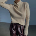 Slim fit silver grey half turtleneck sweater with a breasted button placket on a mannequin.