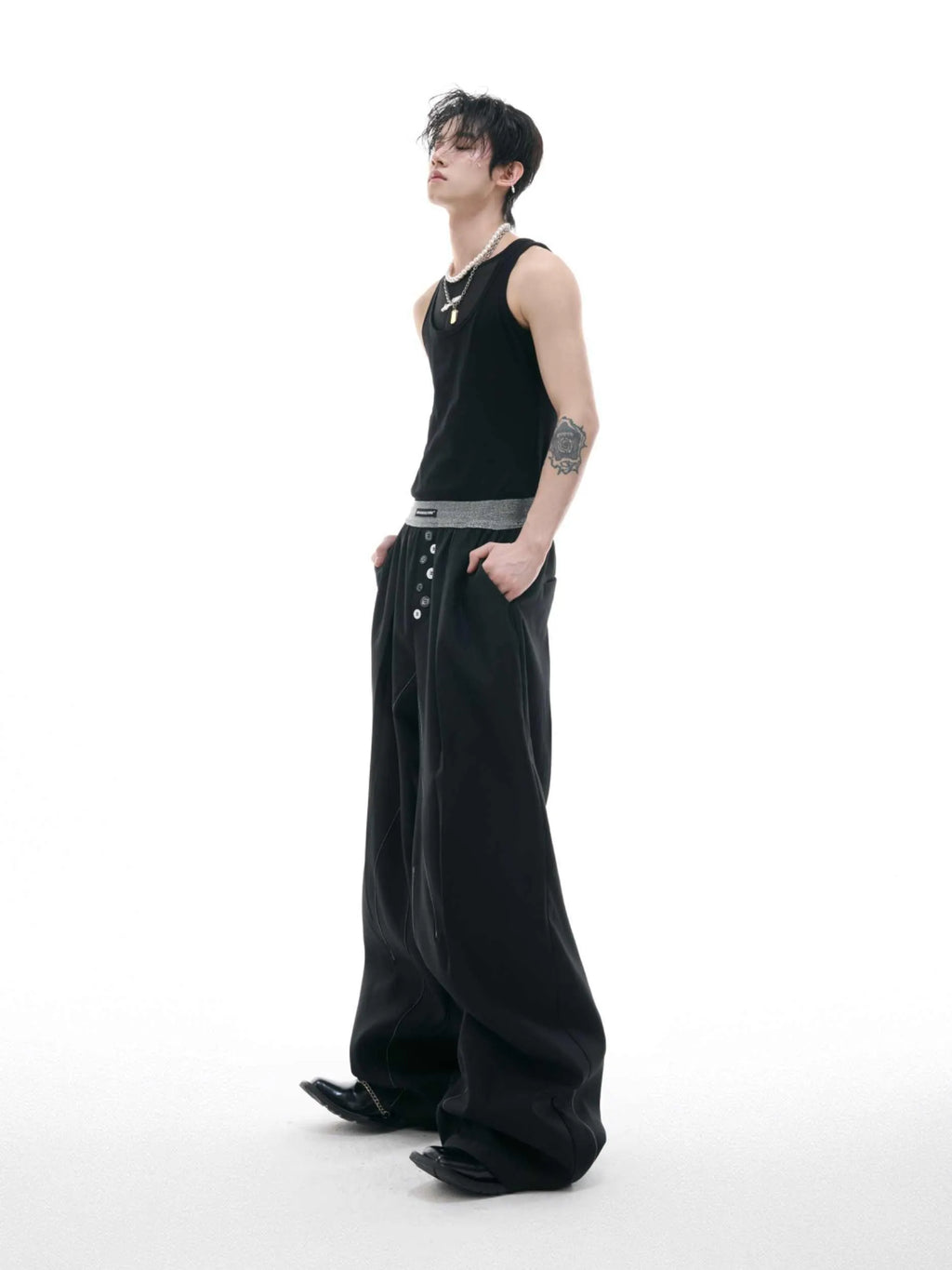 Straight-leg suit pants with button detail on leg in black or grey colour