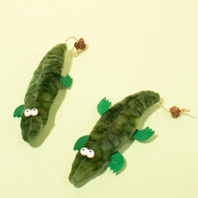 Green plush alligator catnip toy for stress relief and oral cleansing