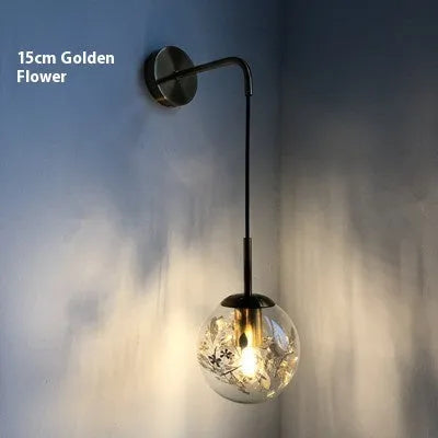 Modern glass bedside wall lamp in golden flower or silver flower finish