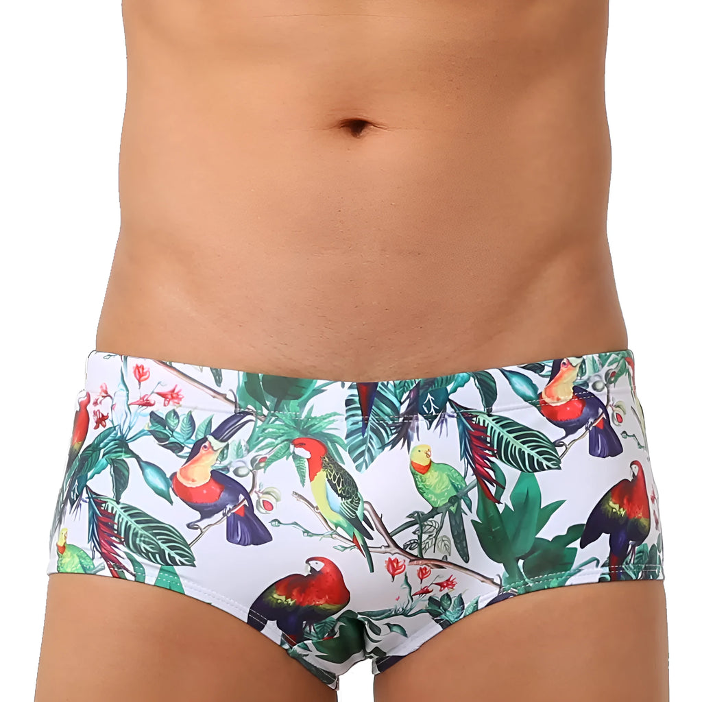 Men's navy blue swimming trunks with colourful flower and bird print pattern.
