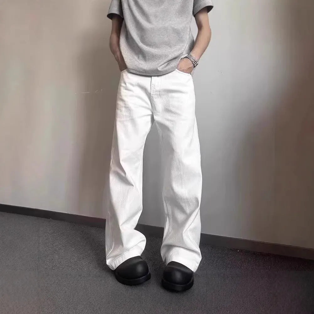 Men's high-grade white loose straight leg denim jeans on a mid-waist.