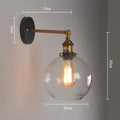 20cm round retro glass ball wall lamp in amber, smoke grey, or transparent finish with aluminium holder.