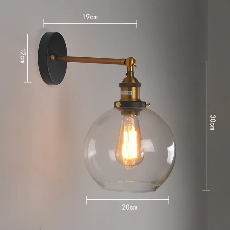 20cm round retro glass ball wall lamp in amber, smoke grey, or transparent finish with aluminium holder.