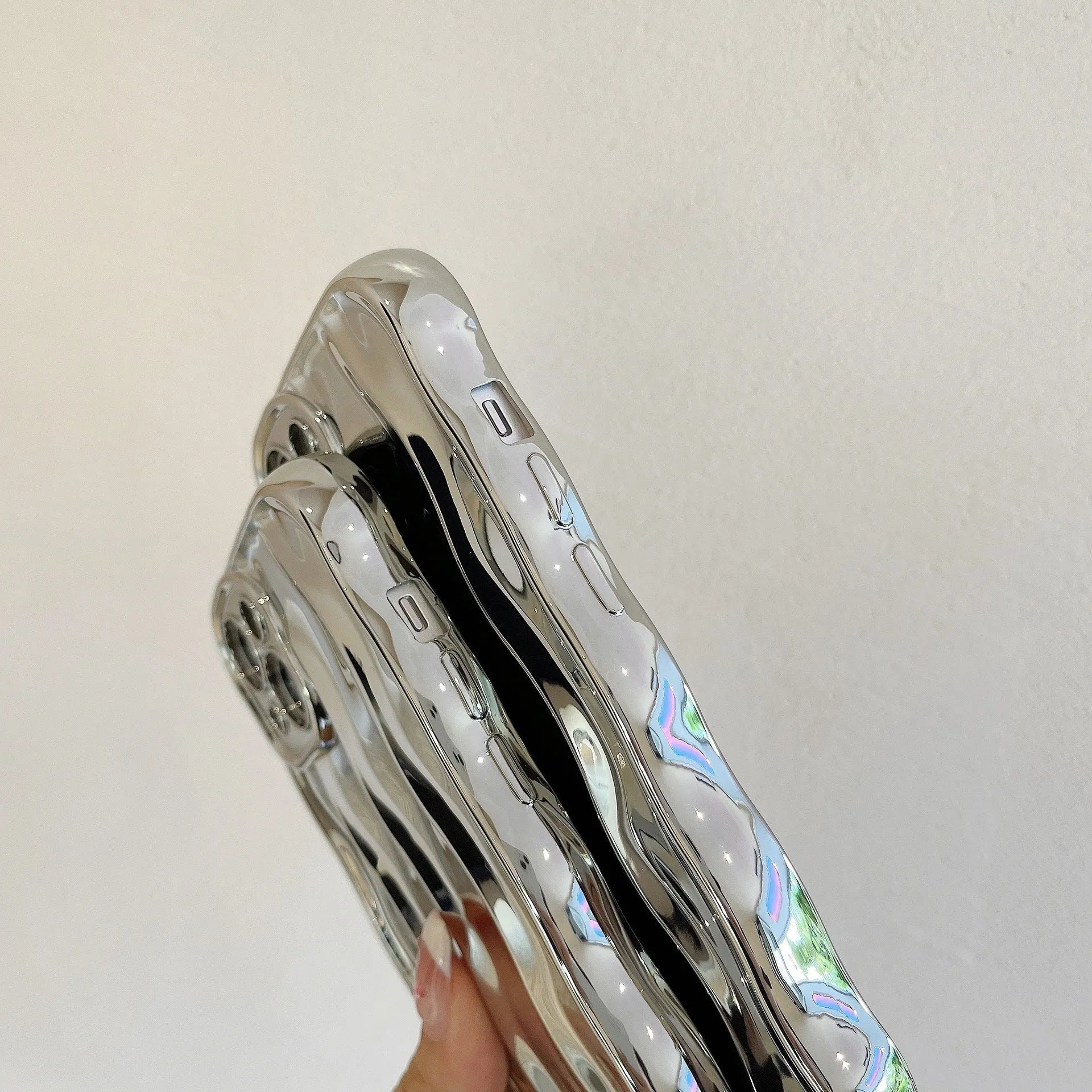 Electroplated three-dimensional wave stripe design protective case for iPhone 17 series in various colours.