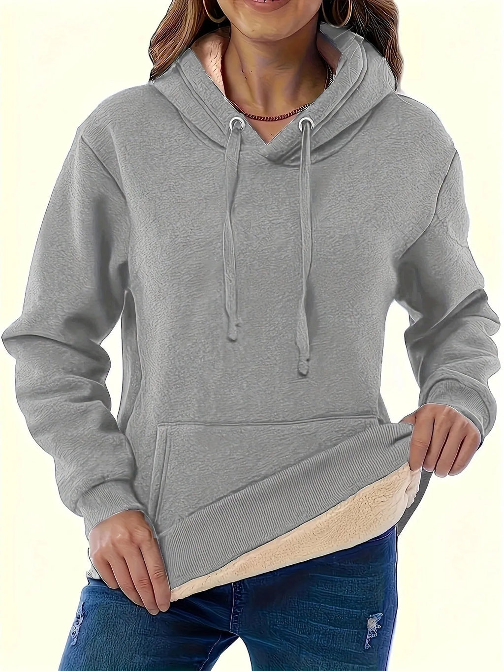 Women's black loose fit hooded sweater with pockets and long sleeves laid flat.