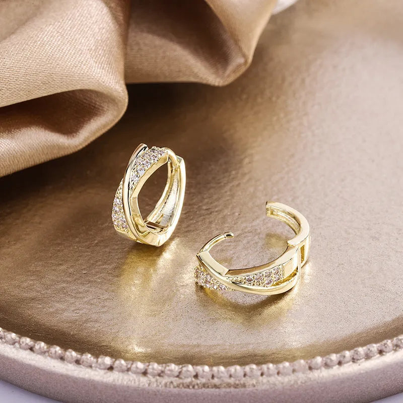 Geometric shape copper earrings with zircon accents in 14K yellow gold tone.