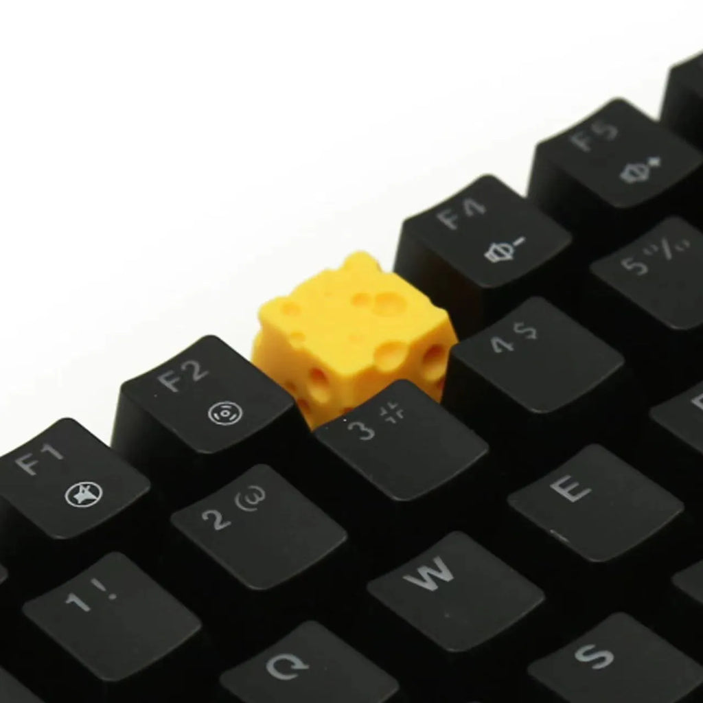 Yellow resin cheese wedge keycap for mechanical keyboards with MX stem mount.