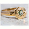 Golden star-shaped ring with oval zircon detailing and adjustable opening