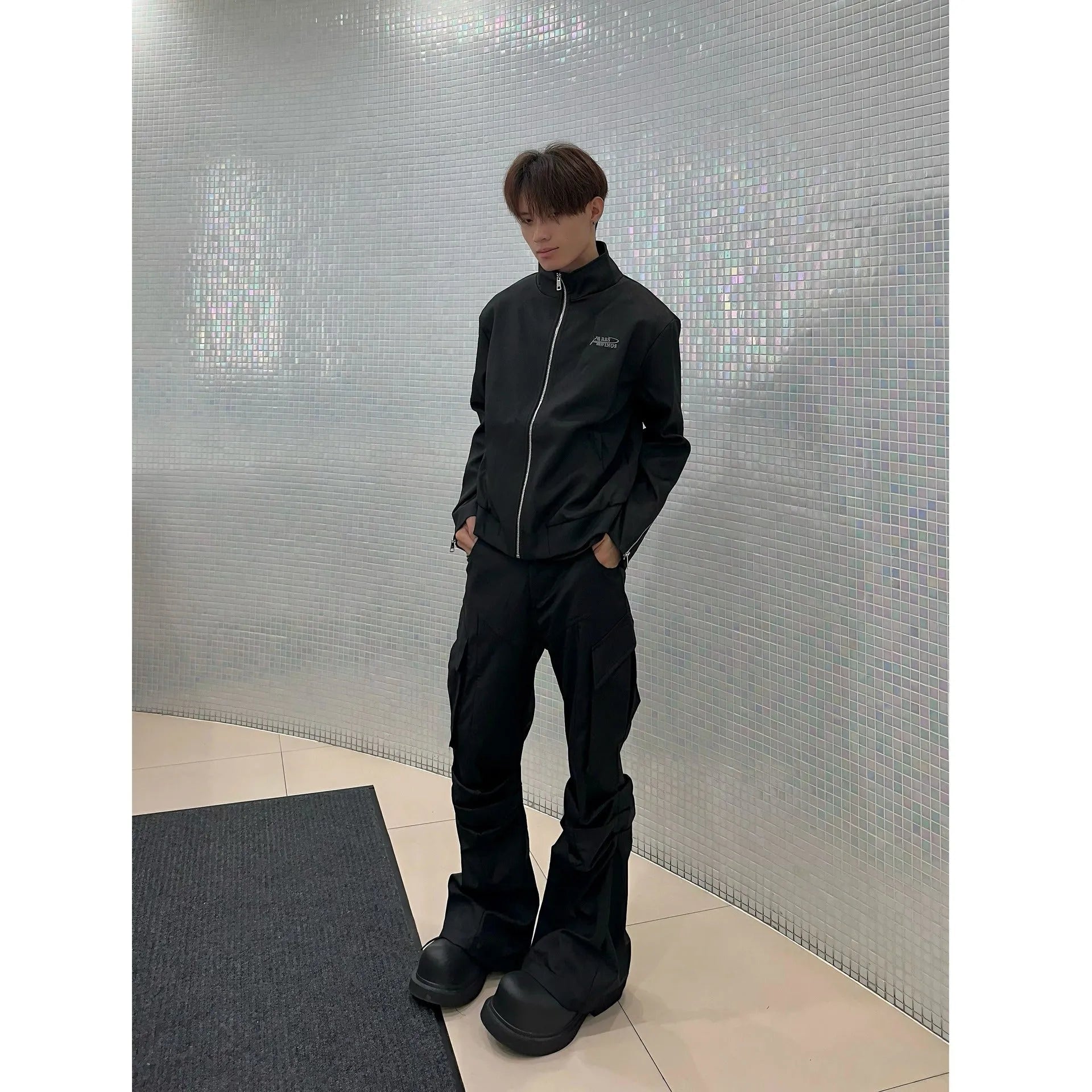 Men's black cargo trousers with large side pockets, straight-leg cut, on a plain background