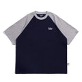 Blue casual men's t-shirt with raglan sleeves on a hanger, showing loose fit.