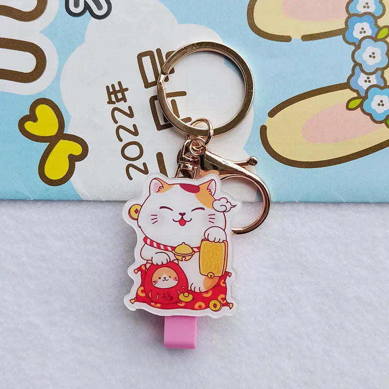 Lucky Cat cartoon-themed plastic card sleeve with a decorative ferrule pendant.
