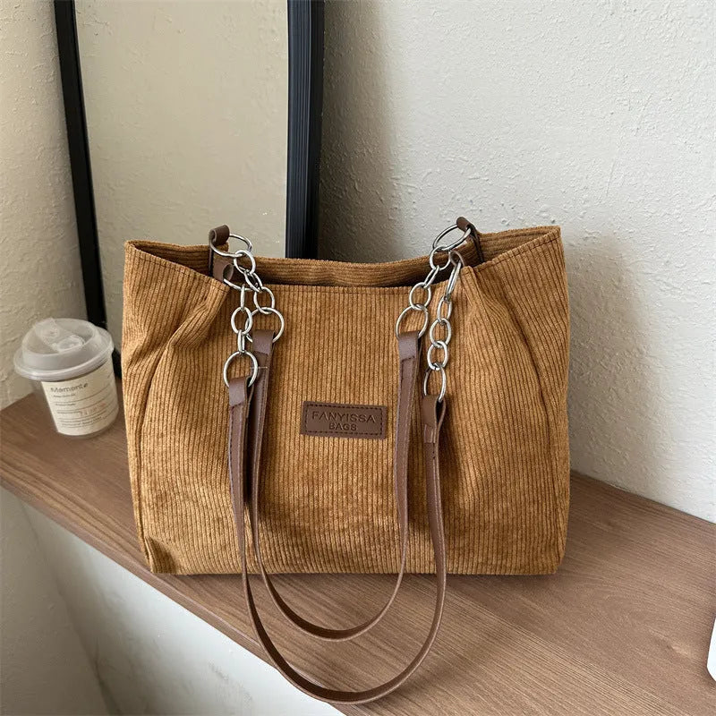 Corduroy one-shoulder tote handbag in horizontal square shape with three-dimensional pocket