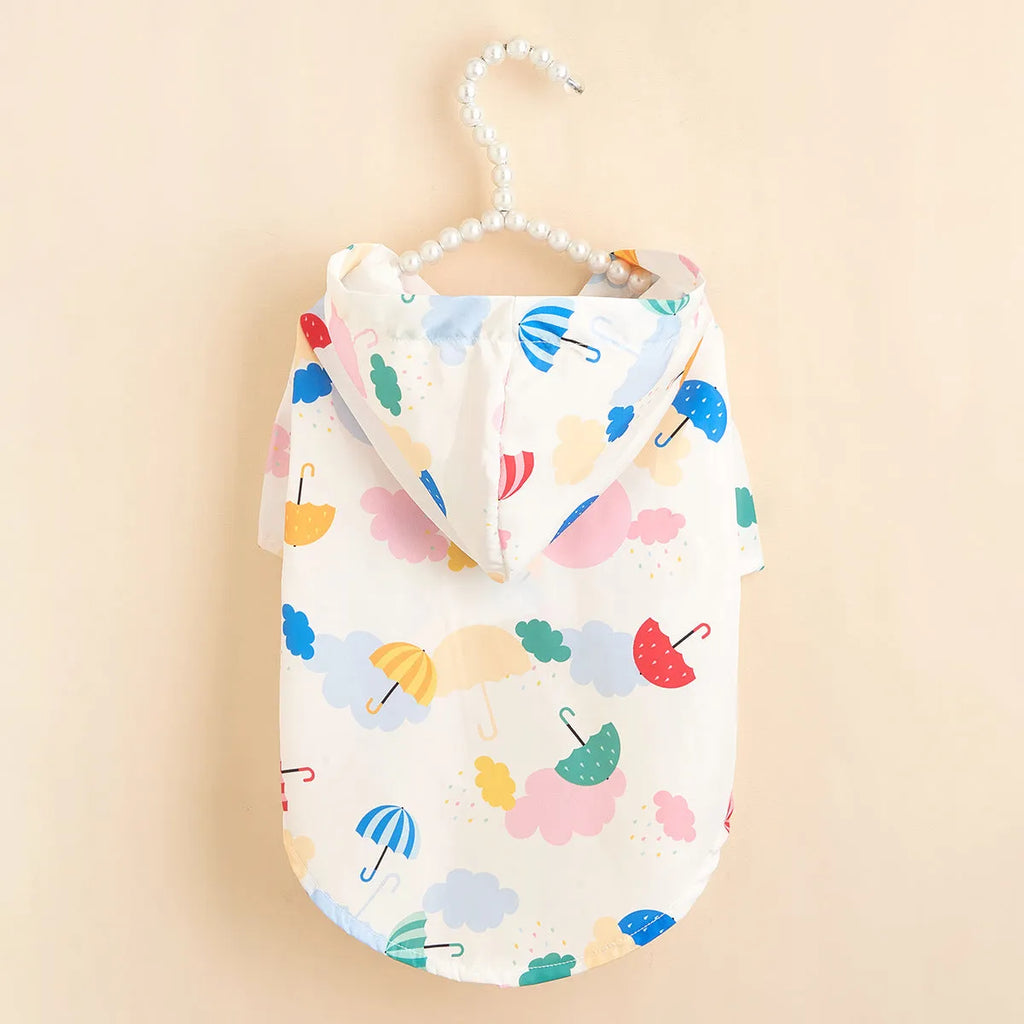 Colourful cartoon umbrella pattern dog raincoat made from polyester fabric.