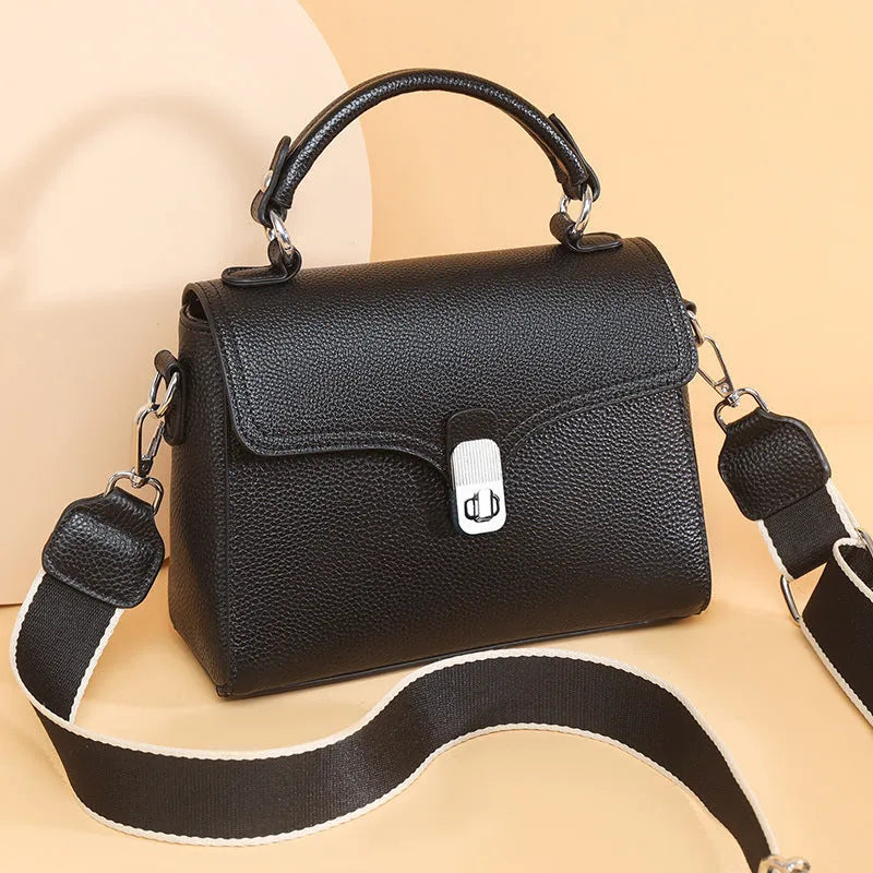 Korean commuter women's cross-body bag in genuine leather, oval shape, size 21x18x9cm, available in black