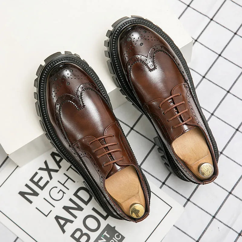 Men's black brogue leather shoes with round toe on a solid background