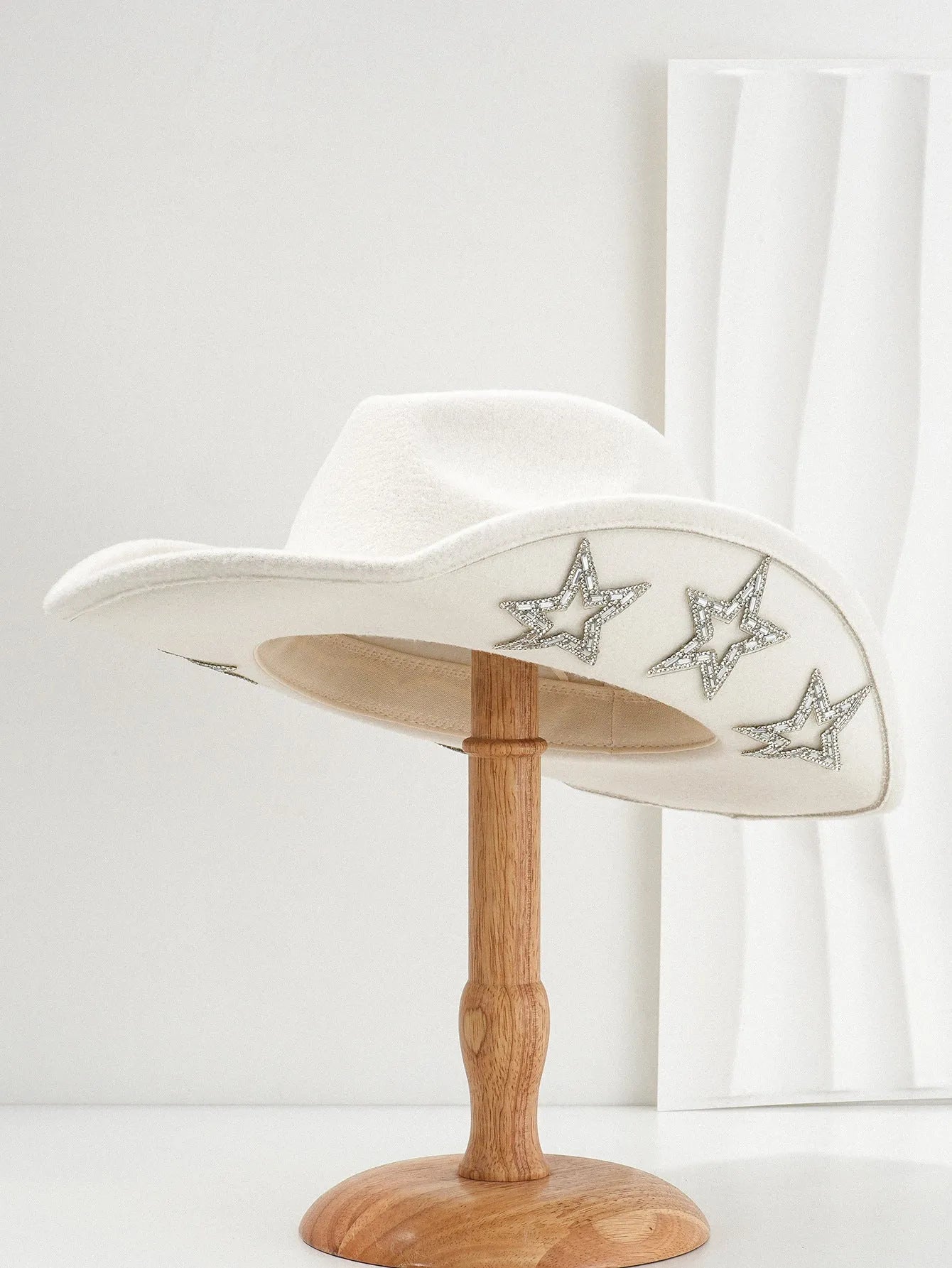 Beige polyester western-style top hat with a conical crown and a woven hexagonal star pattern.