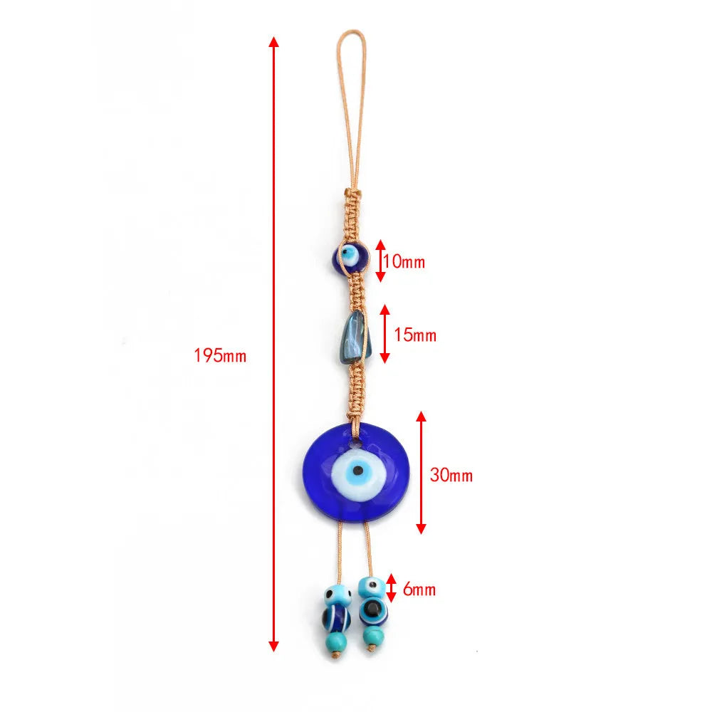 Glass evil eye bead ornament with Turkish blue eye pattern and braided string for wall or car hanging