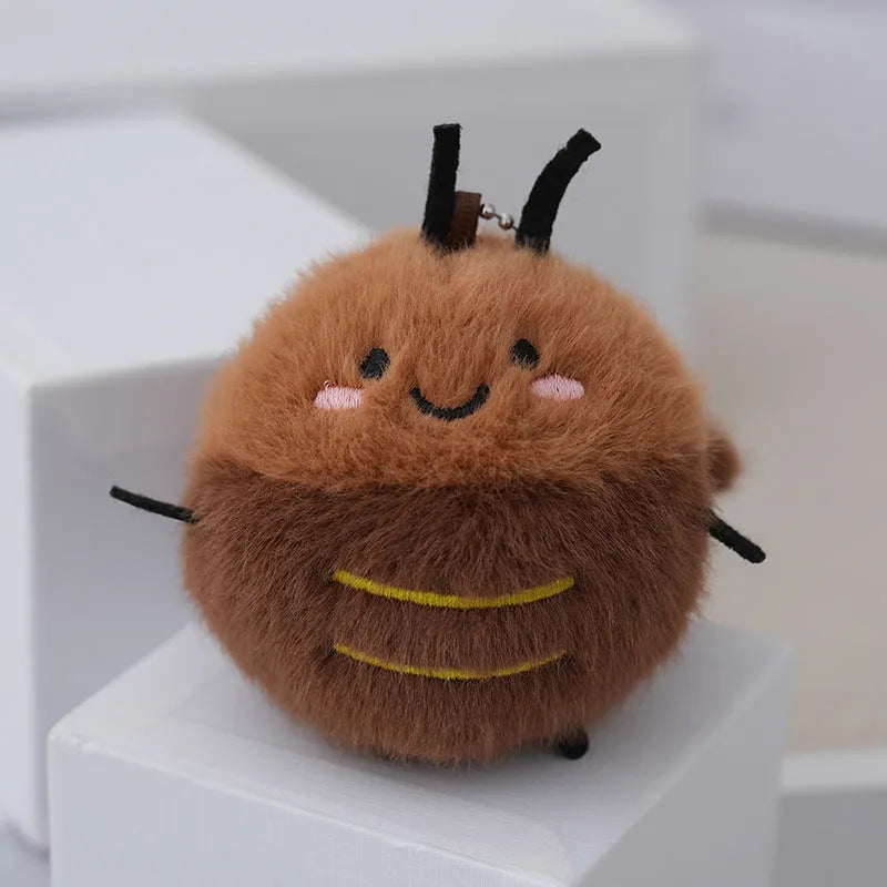 Small mink velvet cockroach pendant plush toy doll with black eyes, 8cm height, on a light background