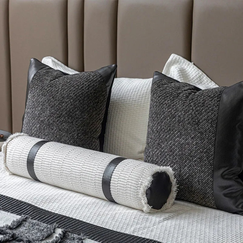 Grey and white plaid polyester bed runner nap blanket set with pillow on a bed.