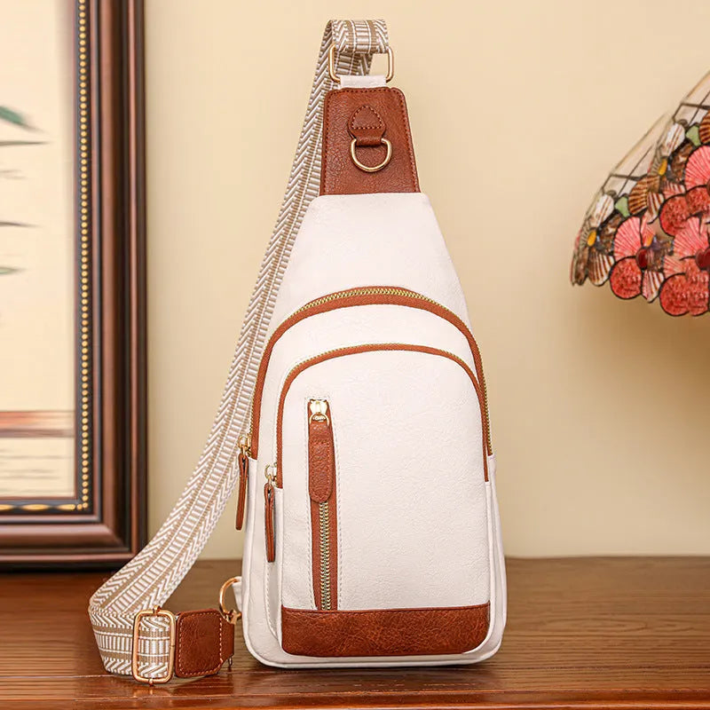 Women's soft brown PU leather crossbody chest bag with open pocket and adjustable strap.