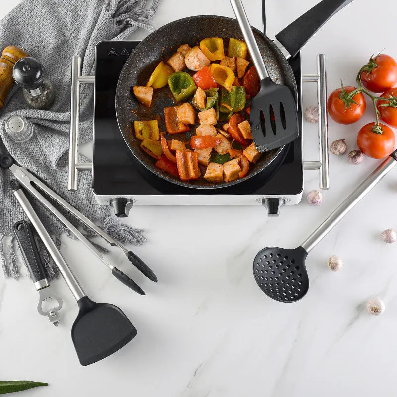 Black kitchen spatula and spoon set with stainless steel handles and silicone ends