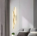 Gold finished double line wall lamp with tri-colour lighting for hotel stairs and modern interiors