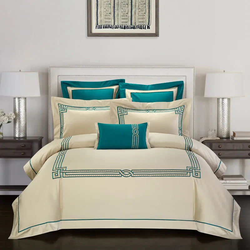 Four-piece embroidered cotton bedding set with traditional embroidery patterns on satin weave fabric