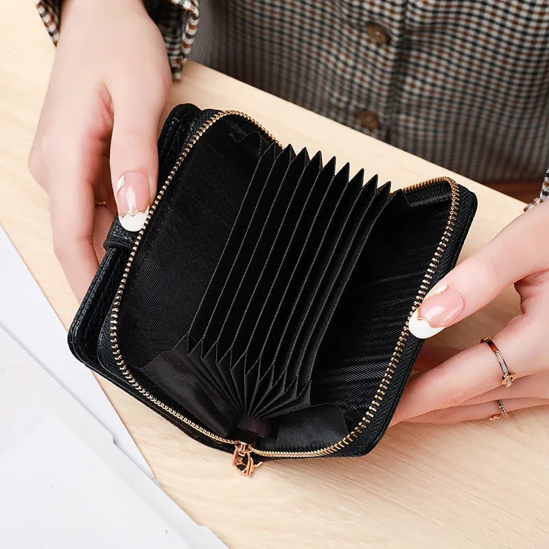Women's lychee pattern organ short wallet in pu leather available in beige pink black and red colours
