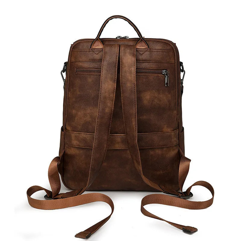 Retro PU leather unisex backpack with curved shoulder straps in solid colour options