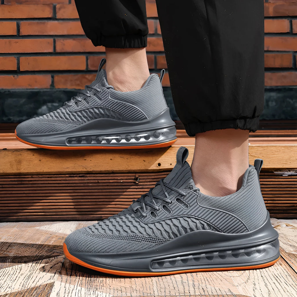 Men's black mesh running shoes with rubber sole and lace-up closure displayed on white background