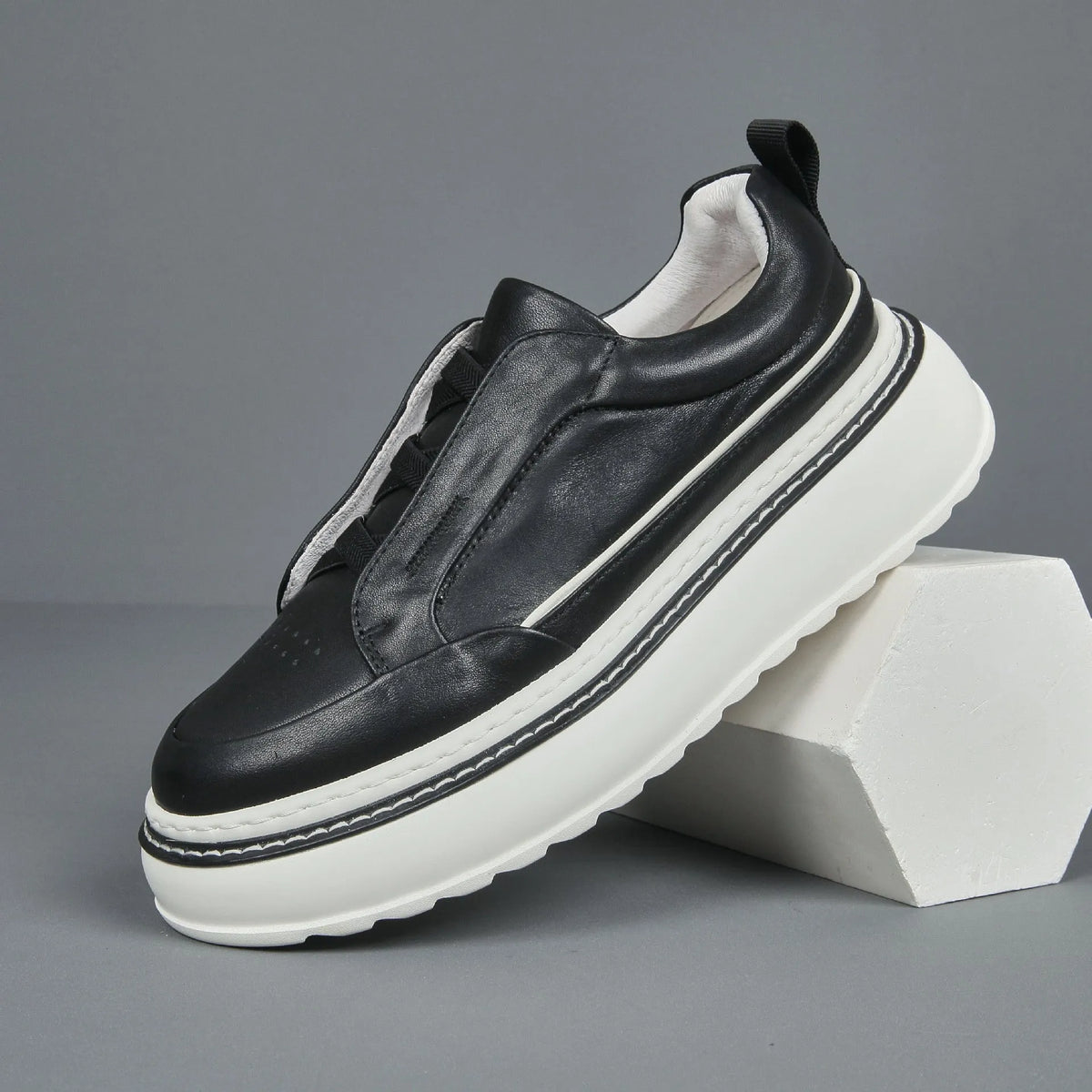 Black breathable first layer cowhide slip-on sneaker with elastic band foam sole low top platform mid heel round toe