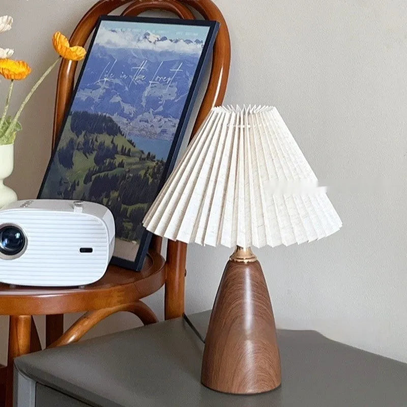 Nordic retro ceramic table lamp with pleated fabric shade and remote control on a bedside table