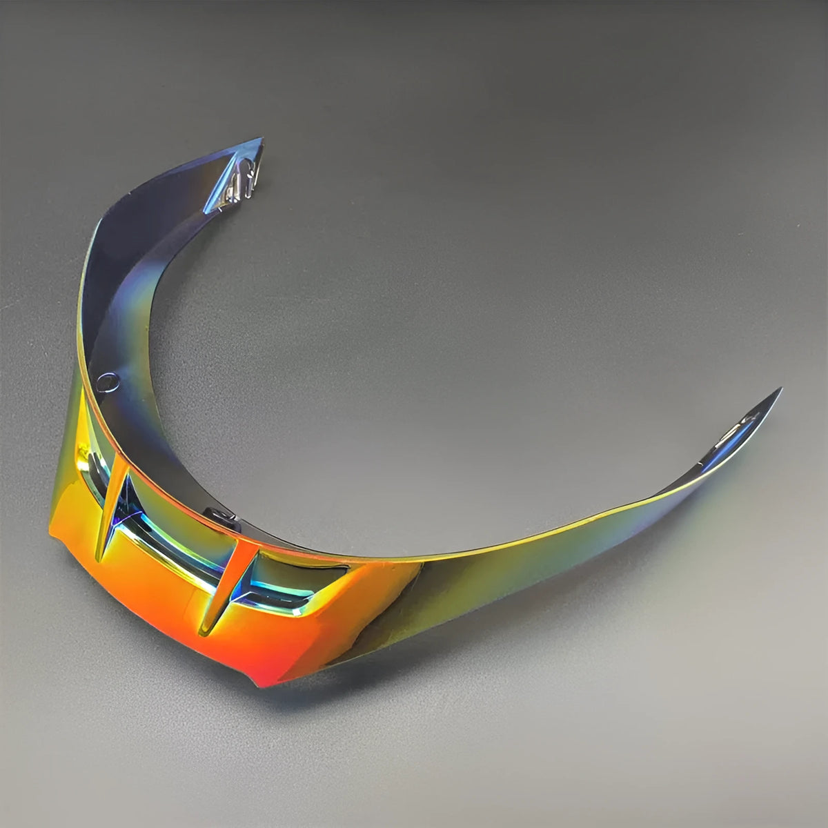 PISTA helmet tail spoiler in clear polycarbonate with three colour-matched screws visible against dark background