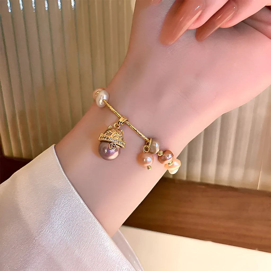 Baroque freshwater pearl zircon bracelet with geometric pearl inlaid design on a woman's wrist