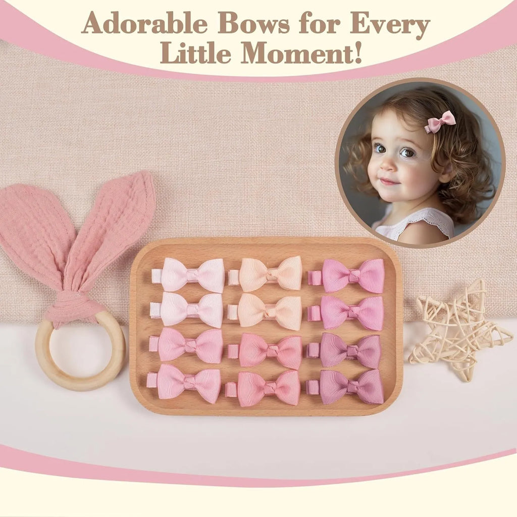 Set of pastel coloured baby hair clips including barrettes and bows on a white background