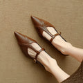 Women's brown pointed toe low-cut flat shoes with a soft sole and cowhide leather uppers.