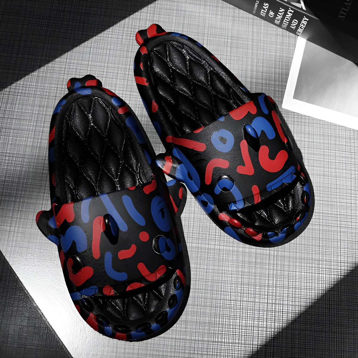 Open-toe shark design couple slippers in EVA material on a white background.