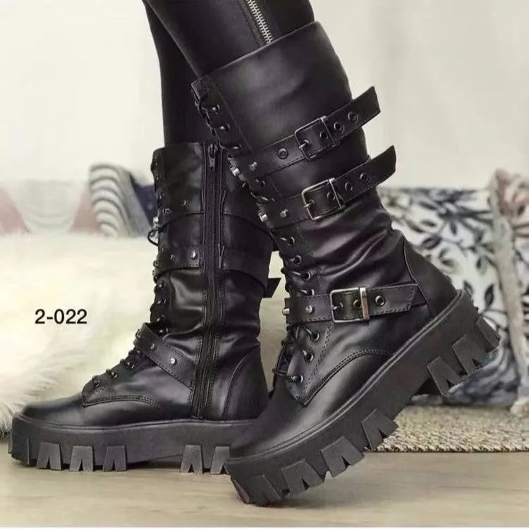 Women's black mid-calf buckle boots with side zipper and round toe, showing metal buckle detail