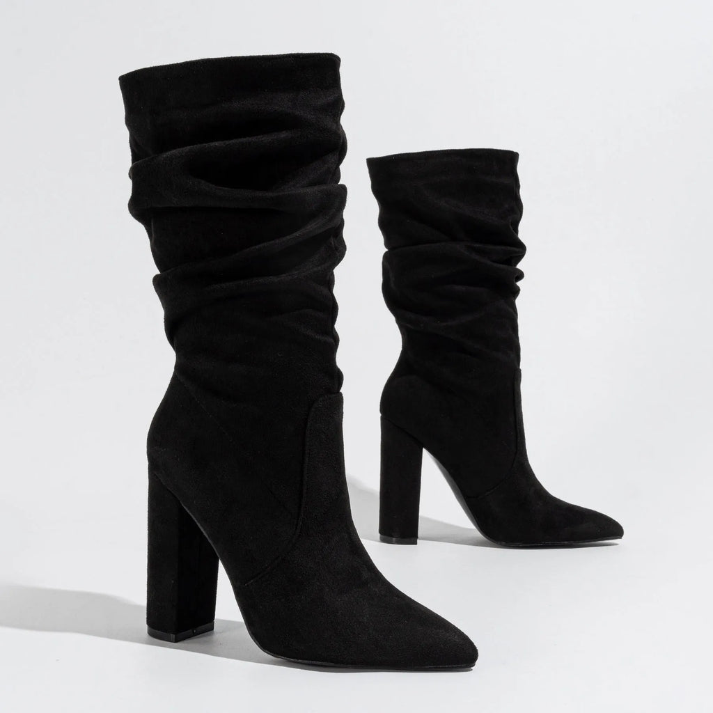 Women's black suede boots with chunky high heel and pointed toe design