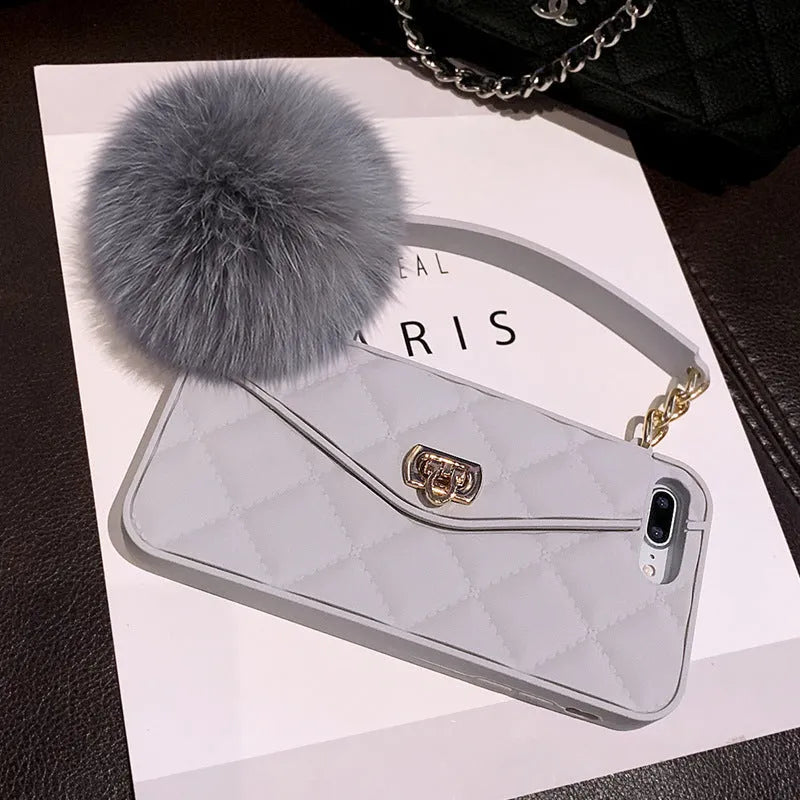 Hairball plush design TPU back cover case for iPhone in dark green, black, and grey grid colours.