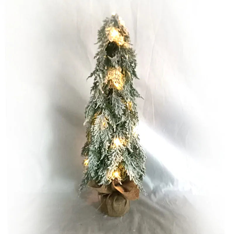 24-inch desktop artificial Christmas tree with LED lights and white snow finish on plastic branches