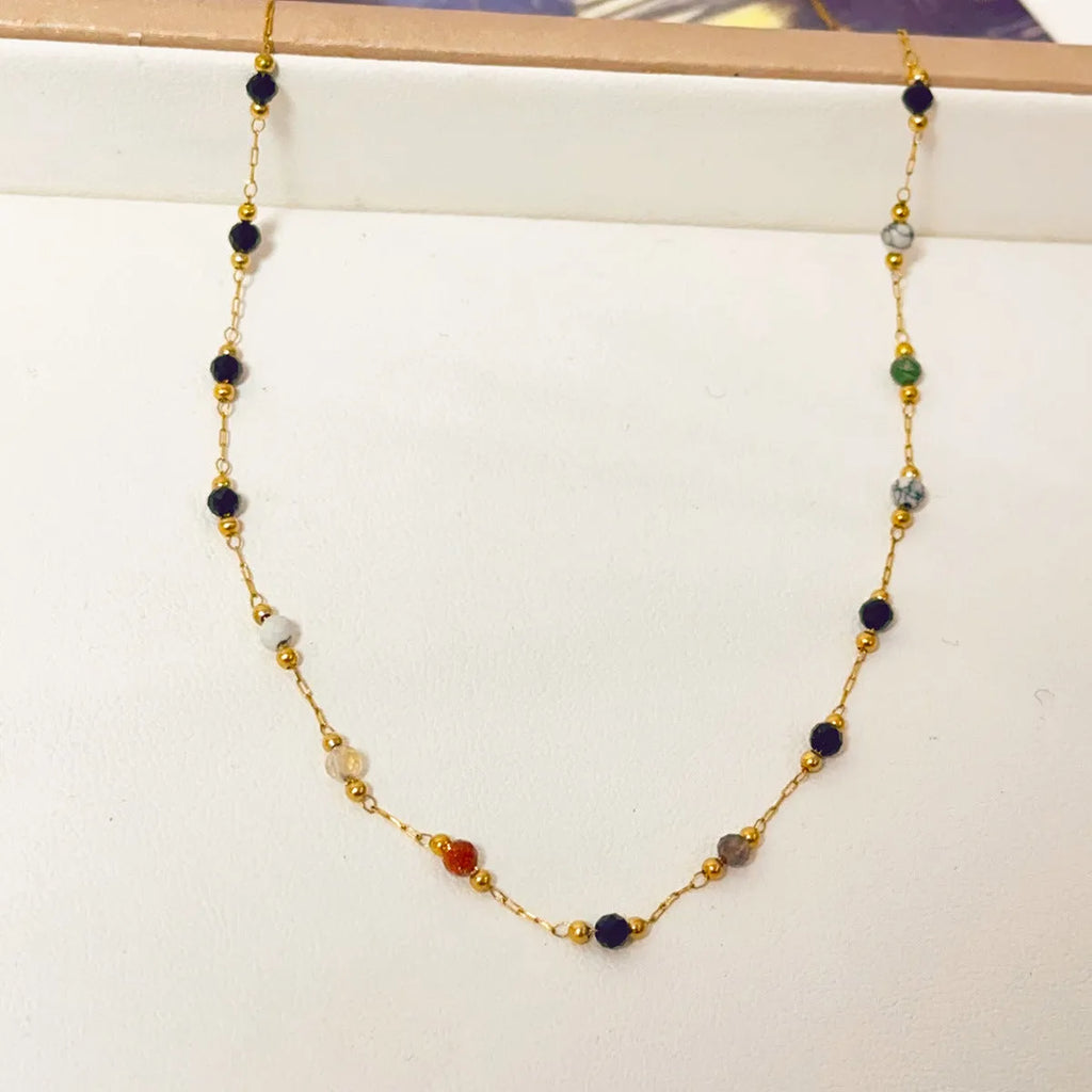 Gold coloured titanium steel necklace with natural stone pendant on O-ring chain.