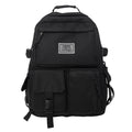 Soft nylon student backpack in black with laptop compartment and three-dimensional pocket
