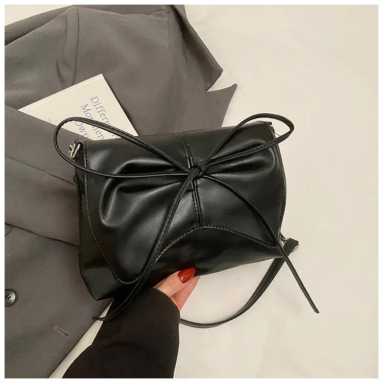 Women's black PU leather crossbody bag with square shape and sewing line detailing